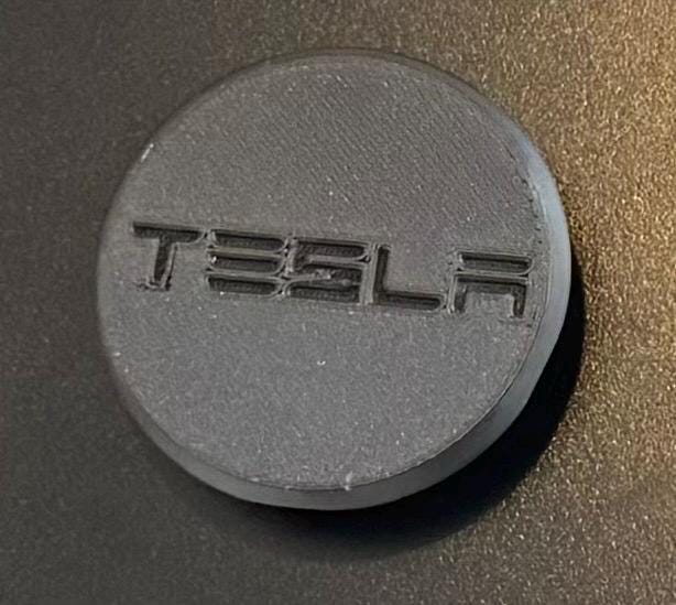 Embossed TESLA Lettering