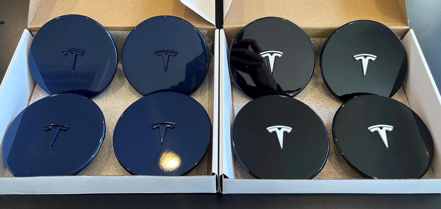 Left: Gemini Mid-Wheel Cover in Deep Blue with Deep Blue T
Right: Gemini Mid-Wheel Cover in Solid Black with Solid White T