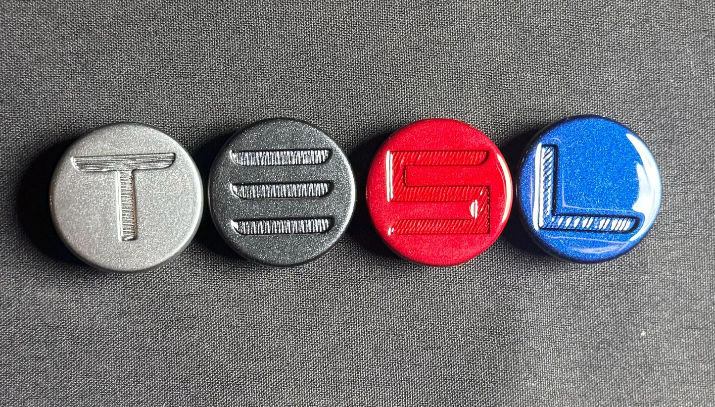 "T" in Quicksilver
"E" in Midnight Silver*
"S" in Ultra Red
"L" in Deep Blue
*Stealth Grey and Midnight Silver look very similar