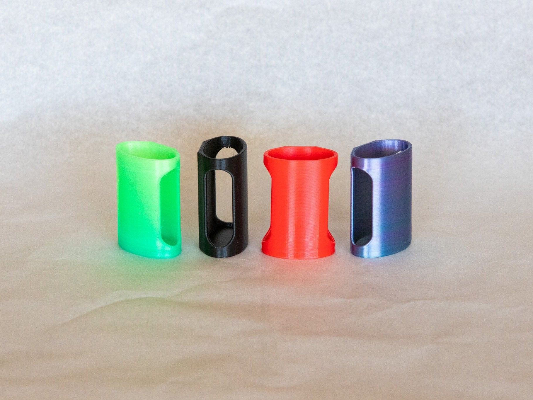 From Left to Right - Green/Blue Glow | Black | Red | Rainbow
